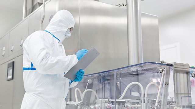 What is the purpose of a clean room suit?