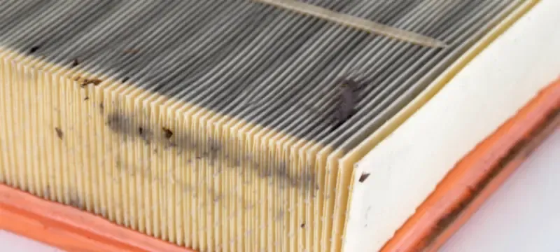 Damaged dirty air filter visible loading close up Damaged dirty air filter visible loading close up
