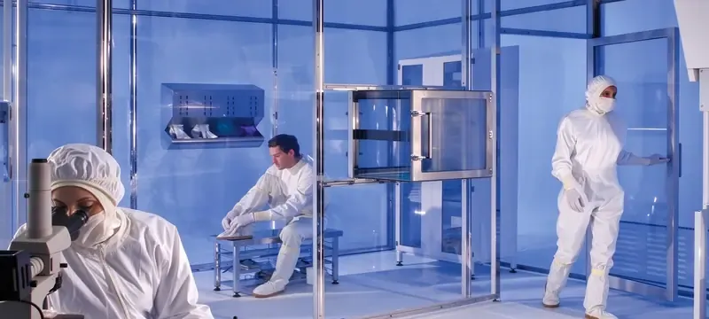 Inspecting cleanroom wall panel surface maintenance worker Inspecting cleanroom wall panel surface maintenance worker