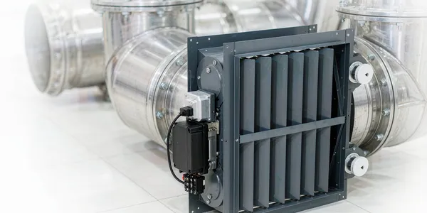 Combination fire and smoke damper with electric release actuator