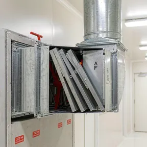 Deiiang fire dampers in laboratory building ventilation ductwork