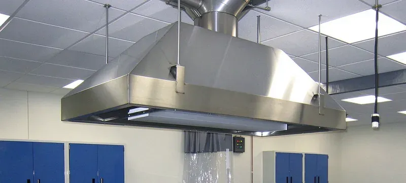 Installed laboratory fume hood with ceiling exhaust ductwork in a laboratory Installed laboratory fume hood with ceiling exhaust ductwork in a laboratory